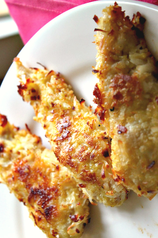 Baked Coconut Crusted Chicken Tenders Recipe! A lighter way to enjoy the coconut chicken fingers you love - bake them! This is a recipe everyone loves and requires only a handful of easy to find ingredients! Kid friendly, great as an appetizer, and only 254 calories per serving