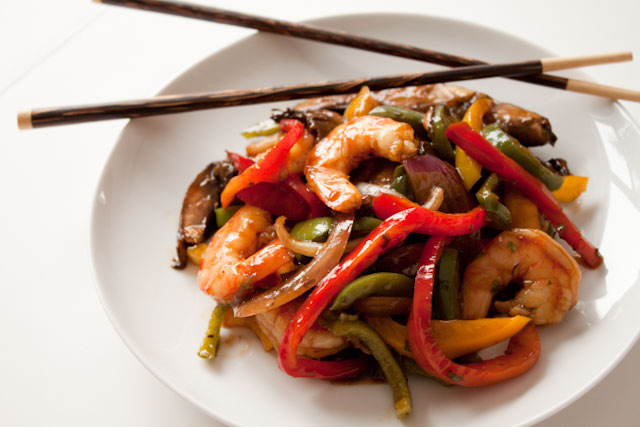 15 Minute Ginger Shrimp Stirfry Recipe! It's as good as the kind you'd order in a Chinese restaurant, with all the gingery, garlicky flavor and about half the calories. And it comes together in just 15 minutes, which is impossible to beat! 
