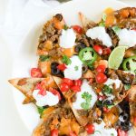 A homemade healthy beef nachos recipe with baked tortilla chips and all the fixins! Here's a hearty portion of your favorite appetizer for only 374 calories!