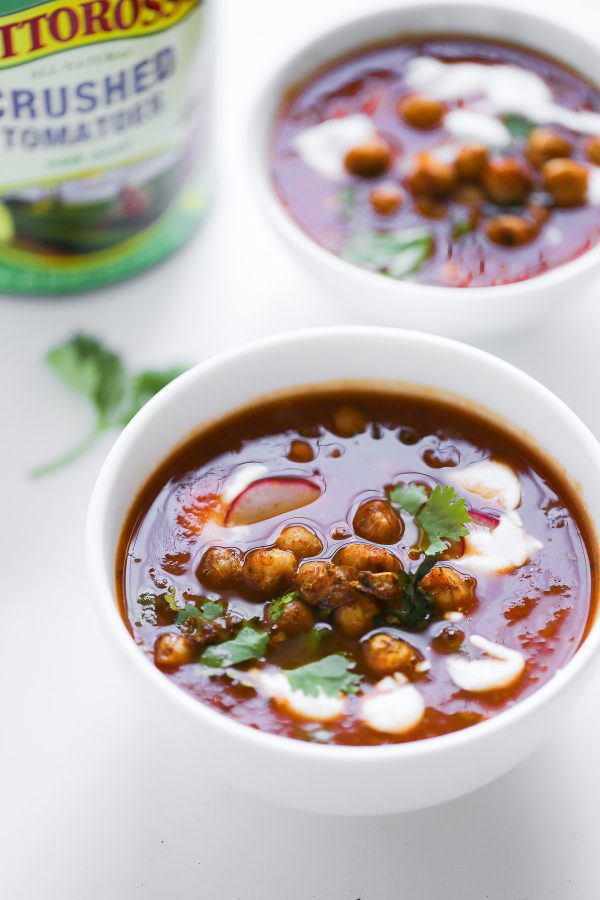 Vegetarian Tortilla Soup Recipe with Chili Roasted Chickpeas! A flavor powerhouse! This vegetarian soup recipe is rich with Mexican flavors like cumin and chili powder, and mildly spicy from sautéed jalapeño pepper. Top the soup with these garlic, oregano, and chili roasted chickpeas to make the soup lighter than traditional versions that have fried tortilla strips, while also boosting the protein and fiber! 