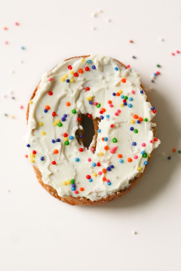 Funfetti Bagel Spread - 5 Delicious and Light Bagel Toppings - here are 5 delicious bagel spreads you can make with no guilt at all! These toppings include flavors like funfetti, pizza, mediterranean, blueberry coconut, and even chocolate peanut butter banana! All have nutrition information!