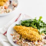 Cornflake Oven Fried Chicken with Honey Mustard Apple Slaw - Lighten fried chicken and keep the flavor! Make this oven fried chicken recipe with crispy seasoned cornflake coating and honey mustard apple slaw!