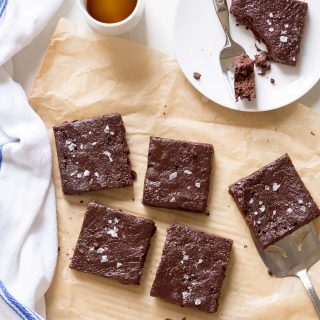 Fudgy 100 Calorie Healthy Brownies - For 100 calories, enjoy fudgy, healthy brownies rich with dark chocolate flavor. Recipe is made with white whole wheat flour, maple syrup, and greek yogurt