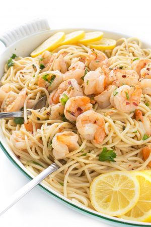 Authentic Shrimp Scampi with Pasta or Zoodles - an authentic Italian recipe with deliciously fragrant garlic shrimp and an easy white wine - butter sauce. 15 minutes to make it! Recipe from Food From Our Ancestors: The Ultimate Italian Sunday Dinner by Liz Della Croce @TheLemonBowl