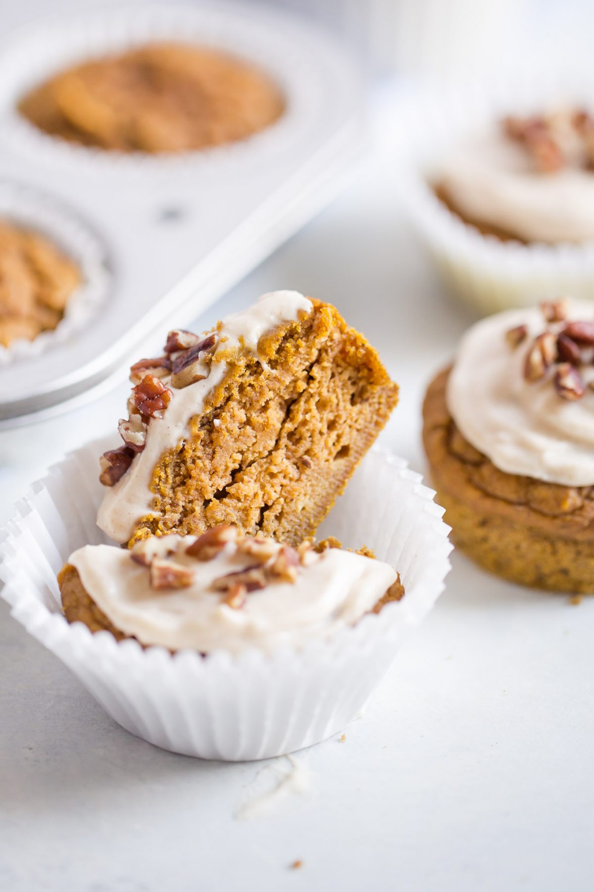 Naturally Sweetened Pumpkin Cupcakes with Maple Cream Cheese Frosting - made with no refined sugar! These are naturally sweetened with medjool date paste!