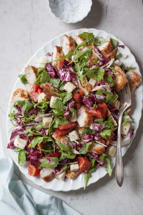 Parmesan Crusted Chicken Caprese Salad Recipe - A spruced up caprese salad made with arugula, radicchio, mozzarella, tomatoes, and crispy chicken cutlets breaded with almond meal and Parmesan!