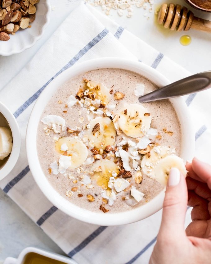 Banana Bread Smoothie Bowl Recipe - made with frozen banana, almond milk, oats, almond butter, cinnamon, and vanilla extract