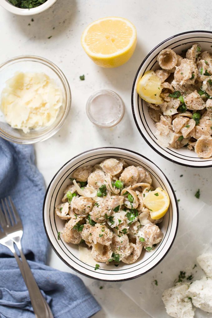 Creamy Orecchiette with Goat Cheese and Tuna Recipe - Move over tuna noodle casserole! This comfort food pasta dish is made with whole wheat orecchiette, herbed goat cheese, canned tuna, and sweet peas! 
