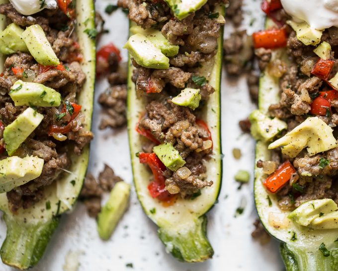Stuffed Zucchini Recipe - made with spiced ground beef and topped with avocado! 