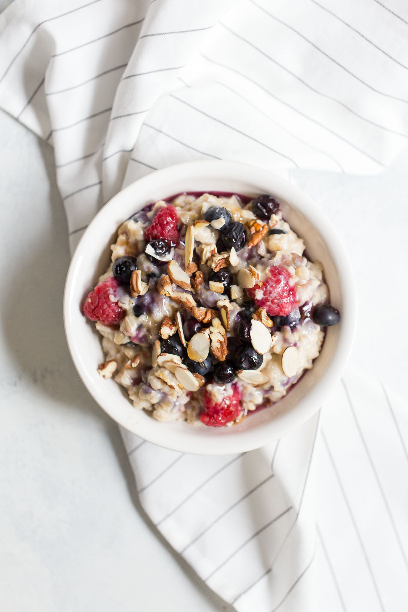 Slow Cooker Oatmeal with Berries, Almonds, and Maple Syrup