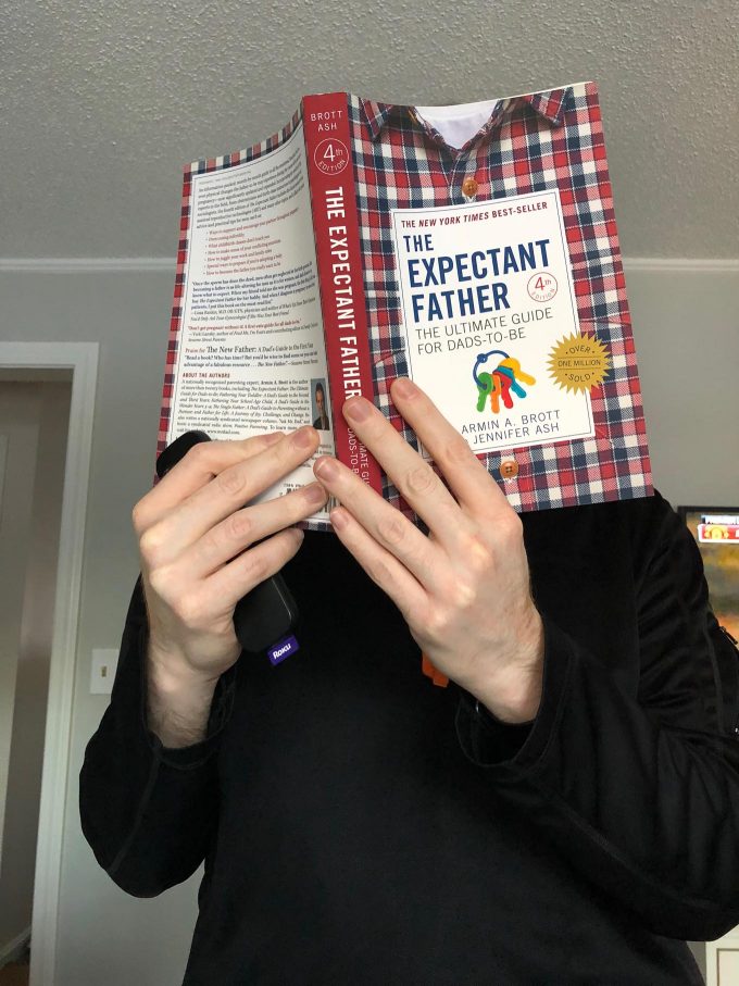 Daniel reading books on fatherhood