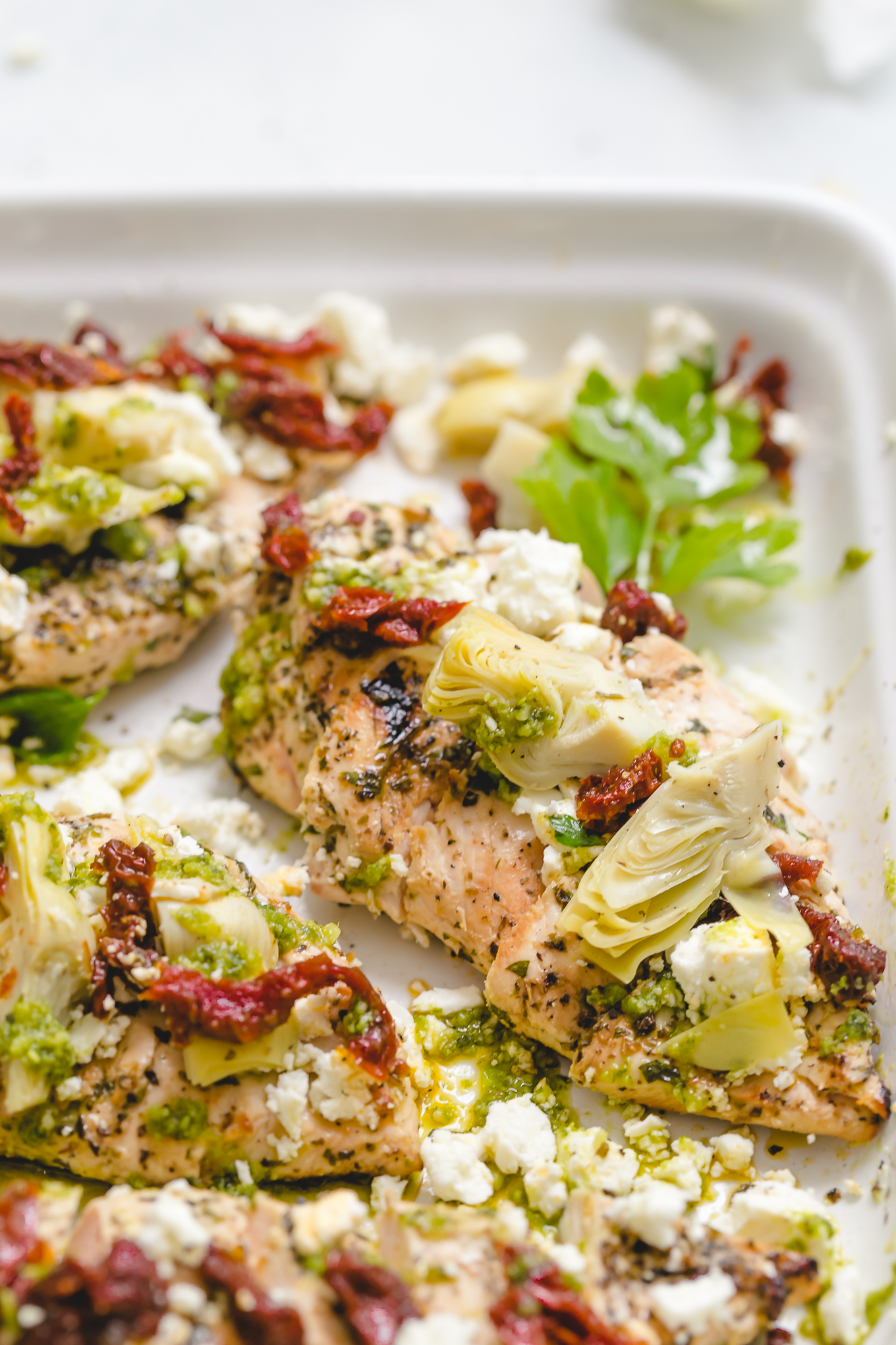 Chicken breasts with toppings on a large serving platter
