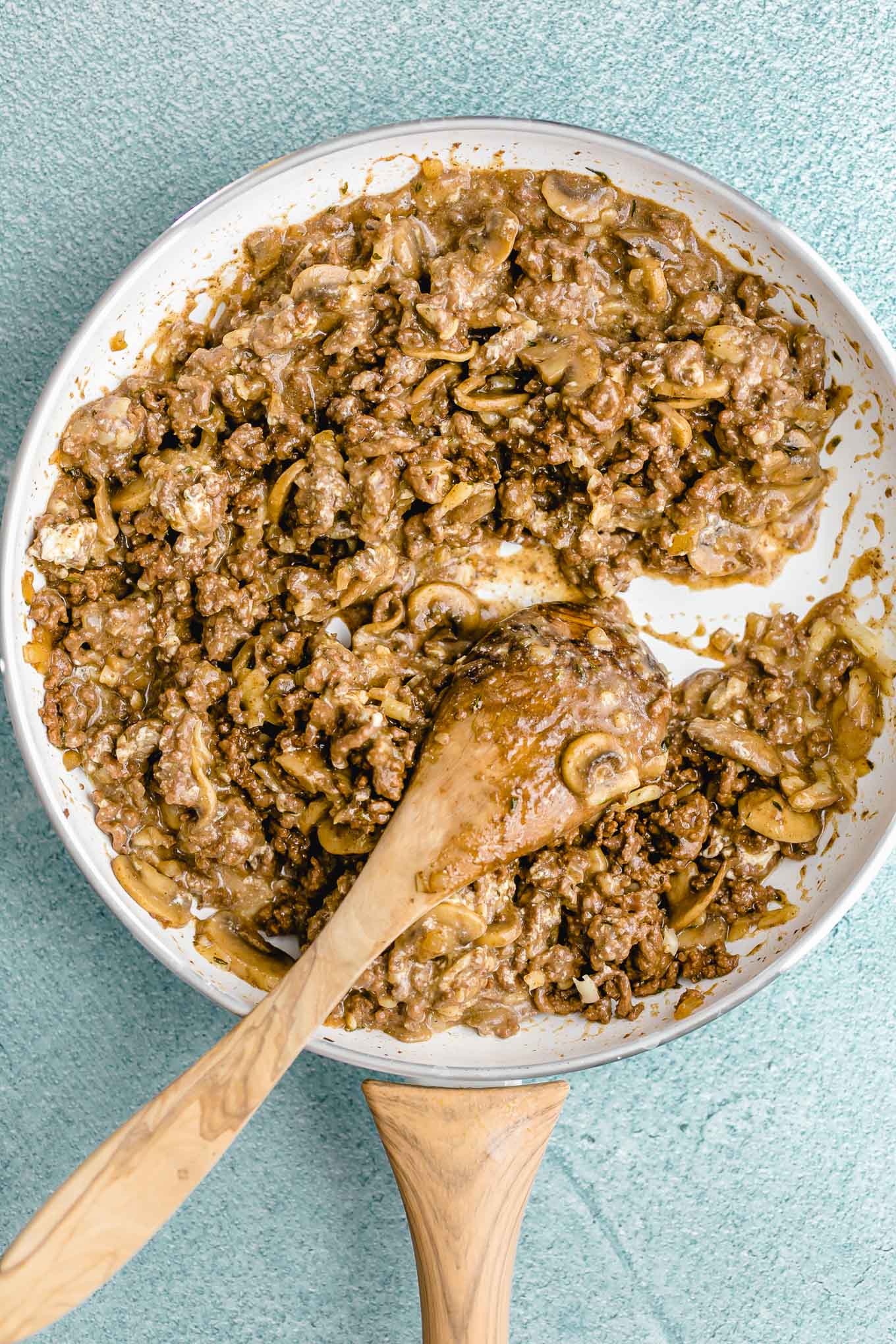Creamy Cheeseburger Skillet with Mushrooms and Swiss! A deliciously creamy, cheesy, fully-loaded cheeseburger skillet that the whole family will love. Make it in just 30 minutes with ground beef, mushrooms, onions, cream cheese, and Swiss cheese. 